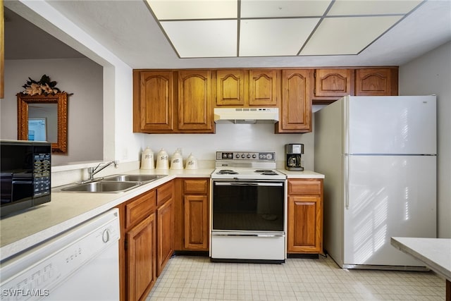 kitchen with sink and white appliances