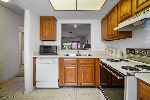 kitchen with ceiling fan, white appliances, and sink