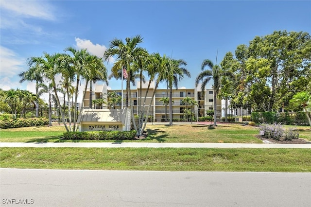 view of home's community with a lawn