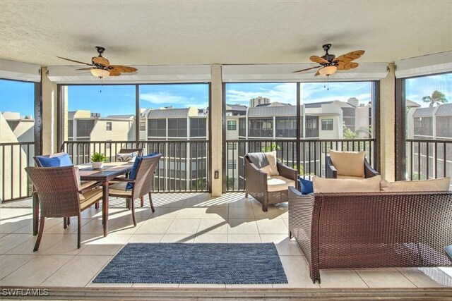 sunroom / solarium with ceiling fan