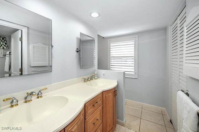 bathroom with tile patterned flooring and vanity