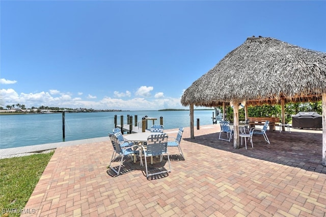 view of patio / terrace with a gazebo and a water view