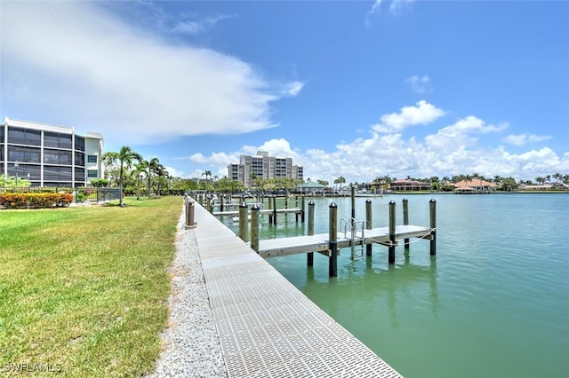 dock area featuring a water view and a yard