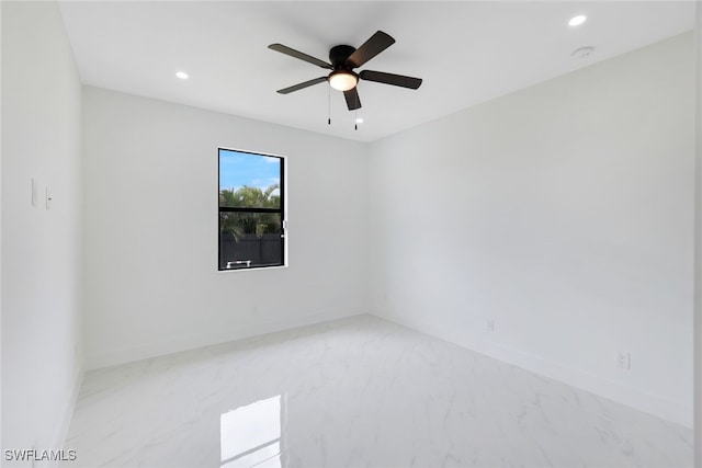 spare room with ceiling fan