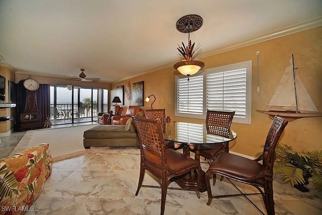 dining room featuring ceiling fan and ornamental molding