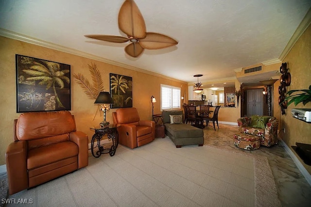 carpeted living room with ceiling fan and ornamental molding