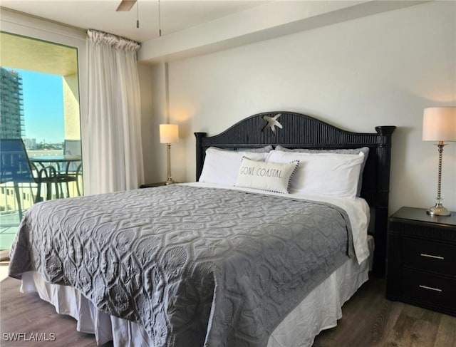 bedroom with access to exterior, dark hardwood / wood-style floors, and ceiling fan