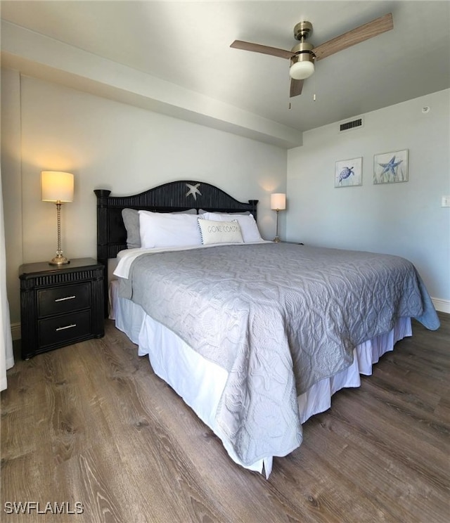 bedroom featuring ceiling fan and dark wood-type flooring