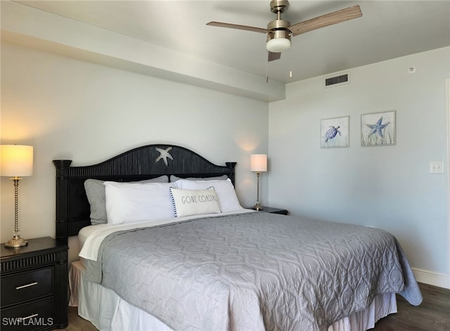 bedroom with ceiling fan and dark wood-type flooring