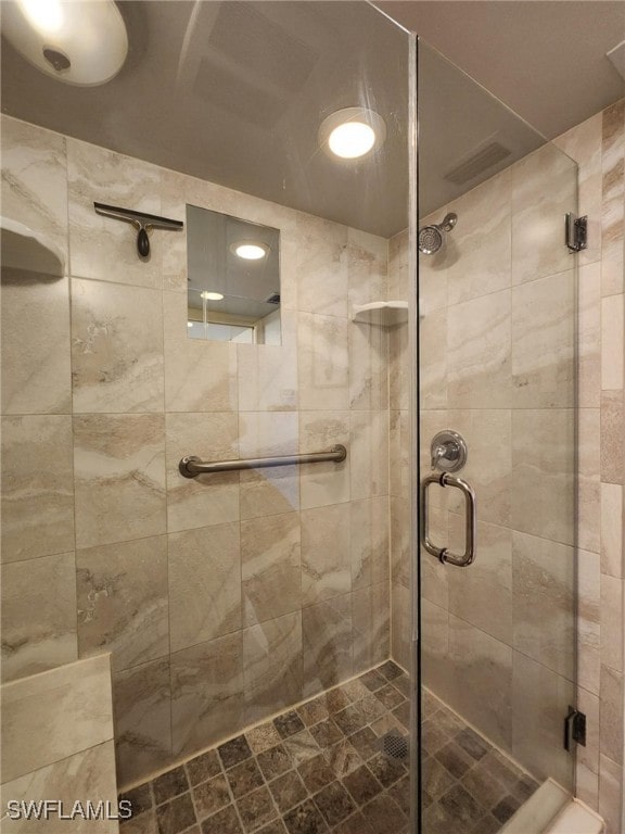 bathroom featuring an enclosed shower