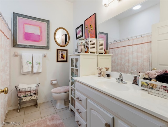 bathroom with tile patterned floors, vanity, and toilet