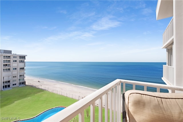 balcony with a view of the beach and a water view