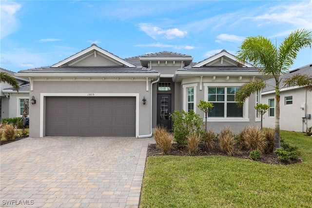 view of front facade with a garage and a front yard