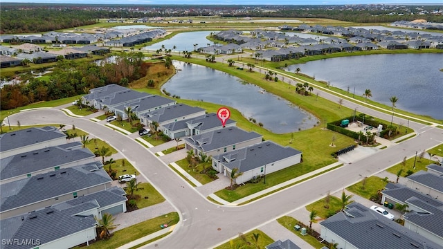 bird's eye view with a water view