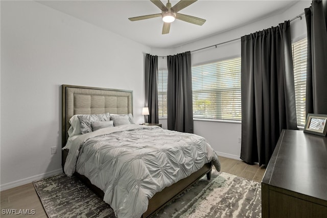 bedroom featuring light hardwood / wood-style floors and ceiling fan