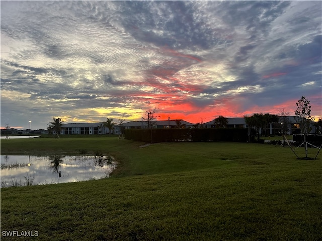 yard at dusk with a water view