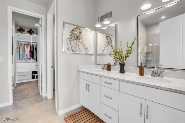 bathroom with vanity, tile patterned floors, and a shower with shower door