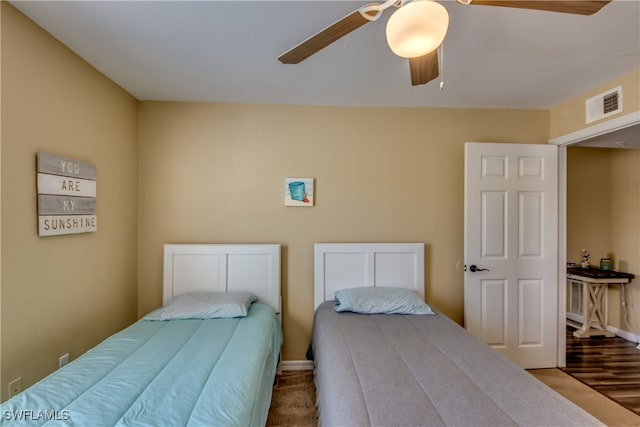 bedroom featuring ceiling fan and hardwood / wood-style floors