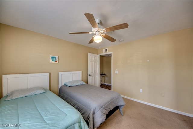 carpeted bedroom with ceiling fan