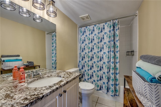 full bathroom featuring tile patterned flooring, shower / bath combo, vanity, and toilet