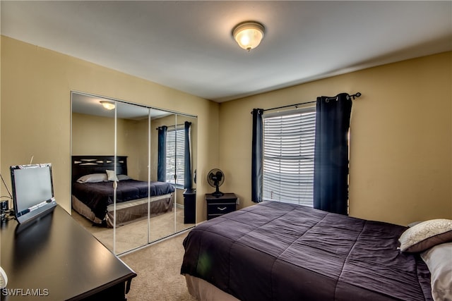 carpeted bedroom with a closet