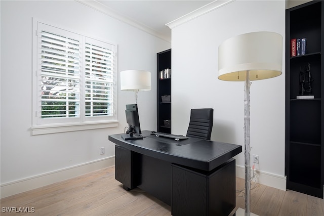 office space with light wood-type flooring and ornamental molding