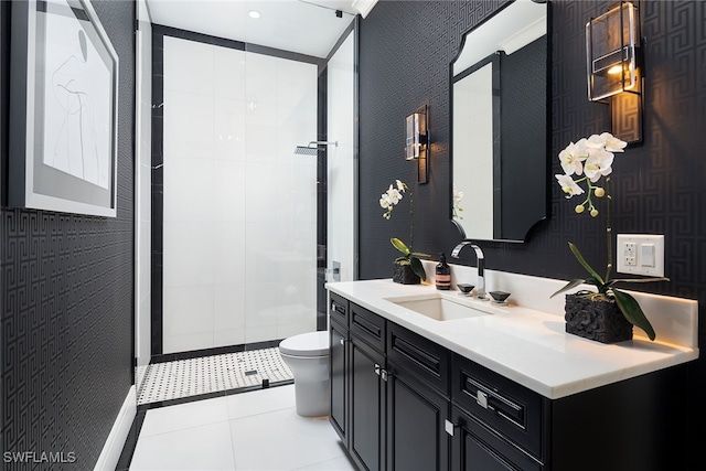 bathroom featuring tile patterned flooring, vanity, toilet, and a shower with door