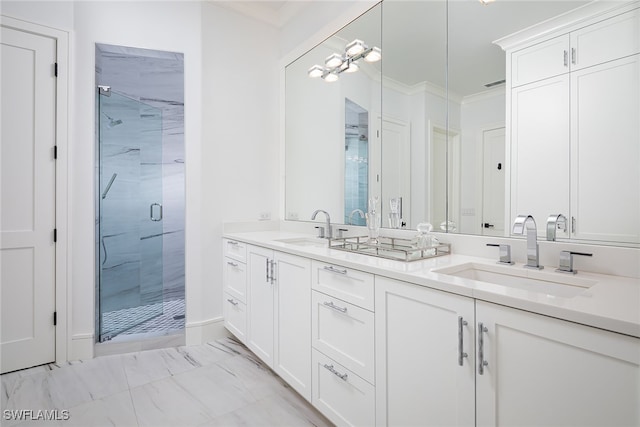 bathroom with crown molding, vanity, and walk in shower