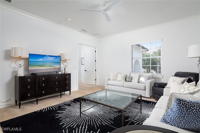 living room featuring ceiling fan, light hardwood / wood-style flooring, and ornamental molding