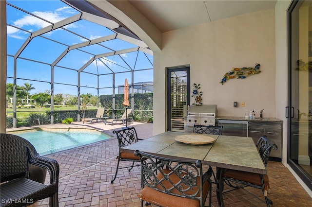 view of patio featuring a lanai and grilling area