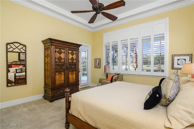 bedroom with crown molding, ceiling fan, light colored carpet, and multiple windows