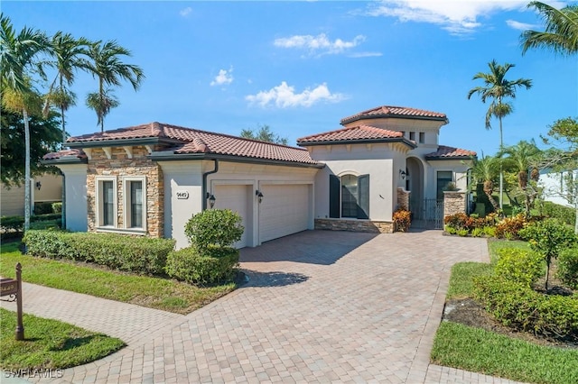 mediterranean / spanish-style home featuring a garage