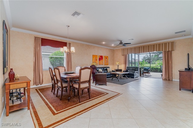 dining space with ceiling fan with notable chandelier, crown molding, and light tile patterned flooring