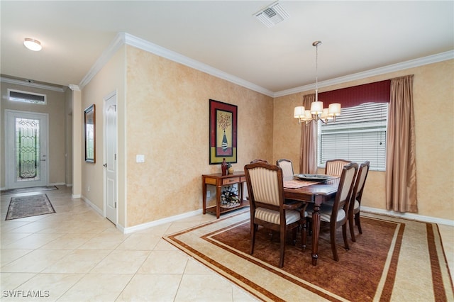 tiled dining area with a chandelier and crown molding