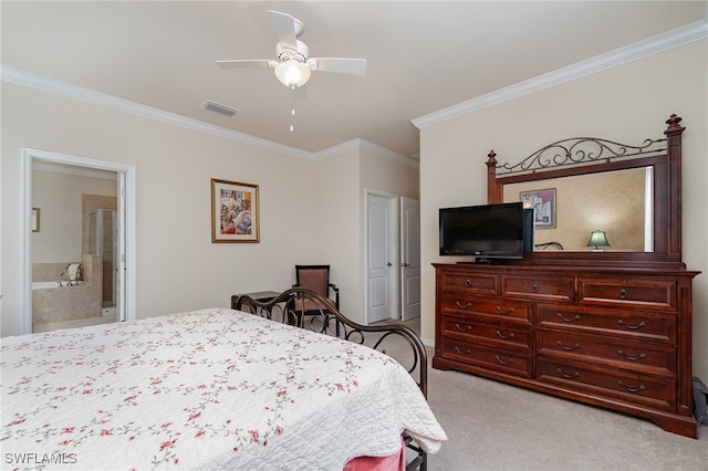 bedroom featuring ensuite bath, ceiling fan, light colored carpet, and ornamental molding