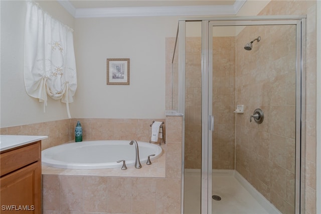 bathroom featuring vanity, ornamental molding, and independent shower and bath