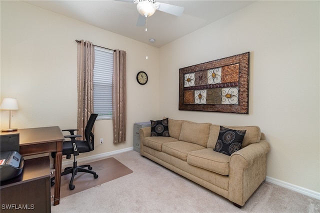 carpeted office space with ceiling fan