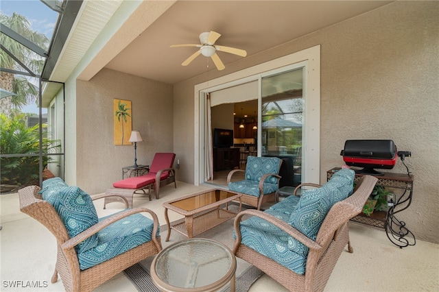 view of patio / terrace with a lanai and ceiling fan