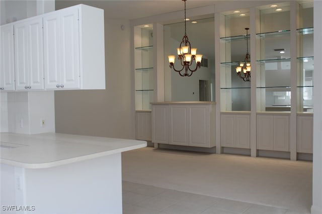 unfurnished dining area with light tile patterned floors and an inviting chandelier