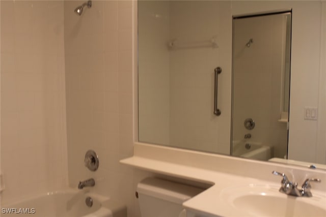 full bathroom featuring vanity, toilet, and tiled shower / bath