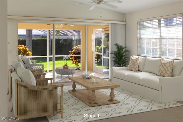 sunroom / solarium with plenty of natural light and ceiling fan