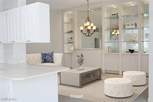 sitting room featuring a chandelier