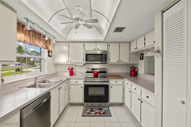 kitchen with ceiling fan, sink, light tile patterned floors, and appliances with stainless steel finishes