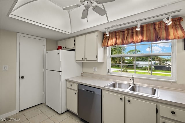 kitchen with ceiling fan, dishwasher, sink, light tile patterned floors, and white cabinets