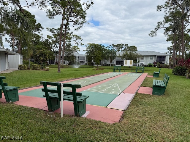 view of community featuring a yard