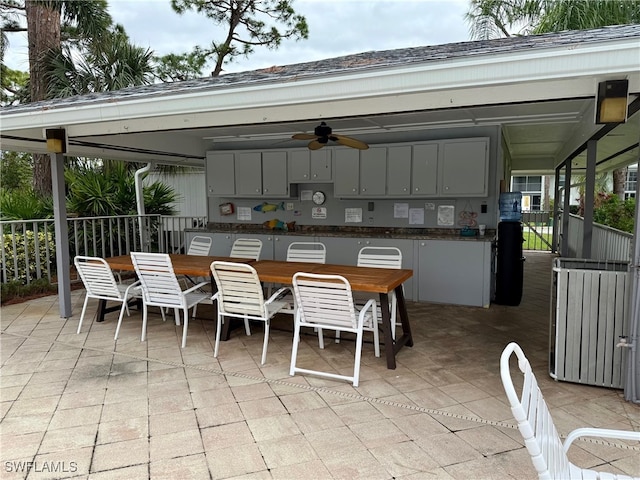 exterior space featuring ceiling fan