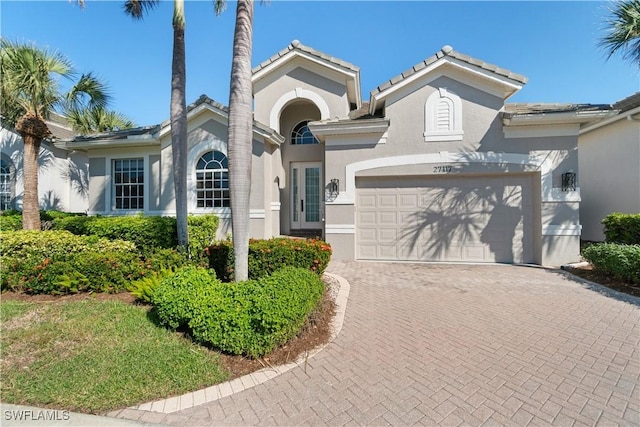 view of front of property featuring a garage