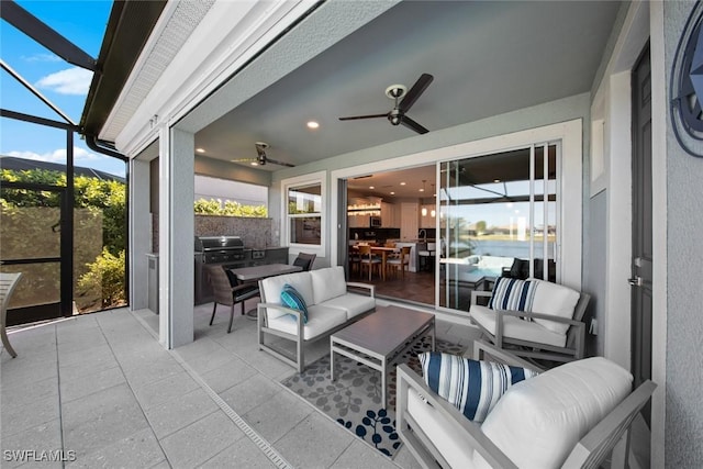 sunroom featuring ceiling fan