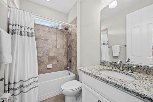 full bathroom featuring vanity, toilet, and shower / bath combo with shower curtain