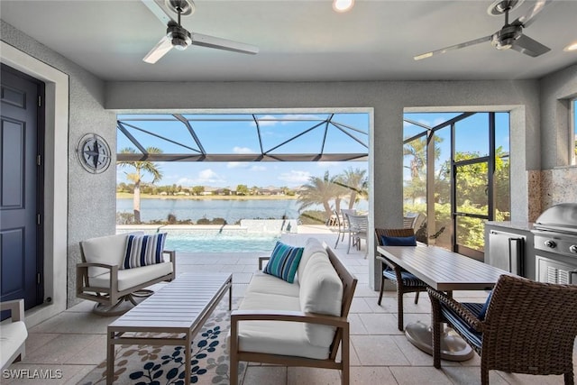 view of patio / terrace with pool water feature, an outdoor living space, ceiling fan, and a water view